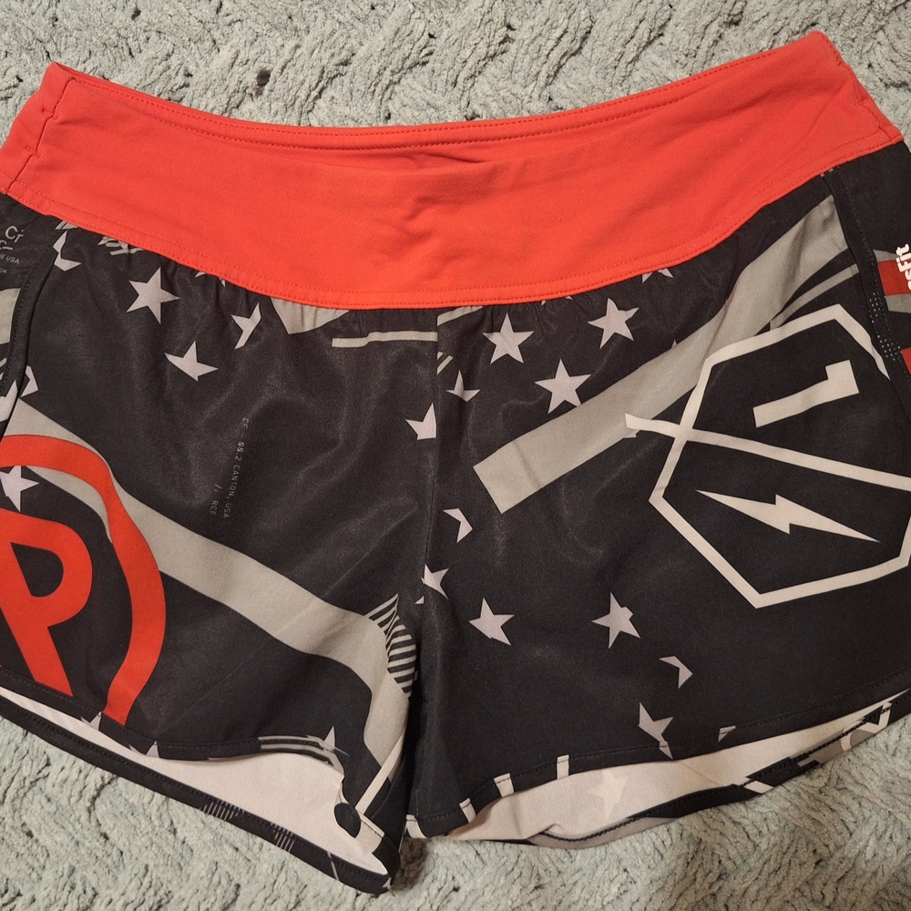 Reebok Black Athletic Shorts with Red Waistband and White Star Print